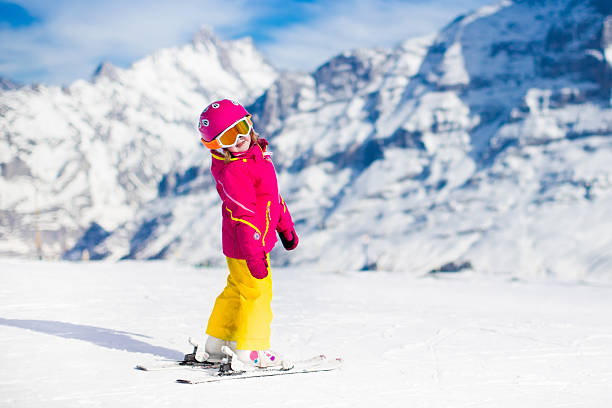 istock Little child skiing in the mountains 616119060