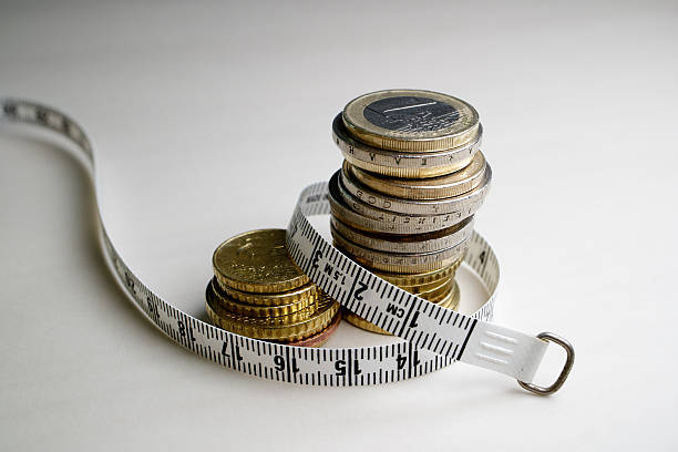 istock Coins and tape measure 616119160