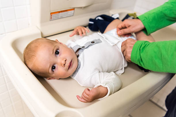 istock Changing diaper in a public restroom 616120454