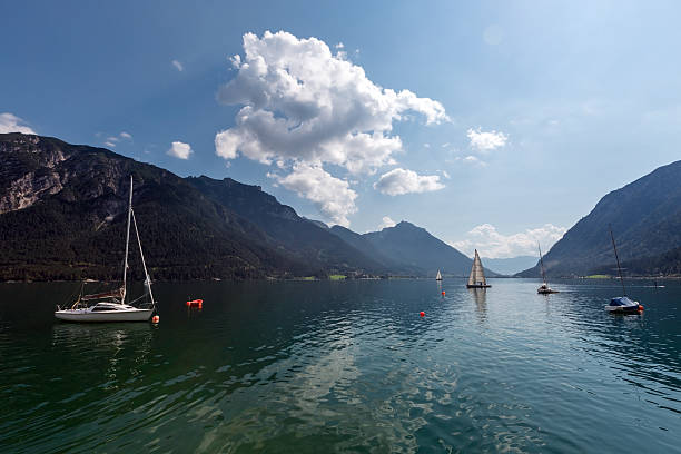 istock Sailboat Sailing on a Blue Mountain Lake 616120860