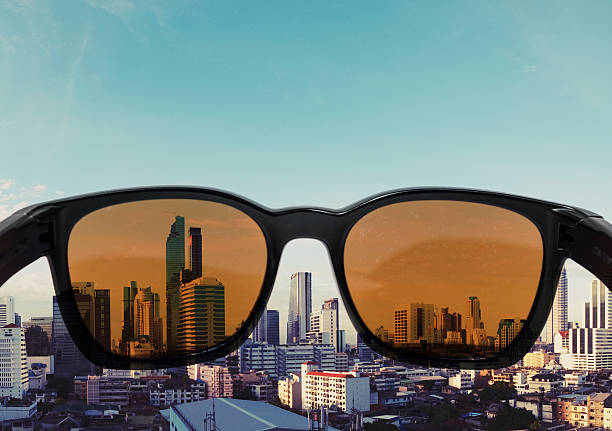 istock Sunglasses looking to city view 616121618