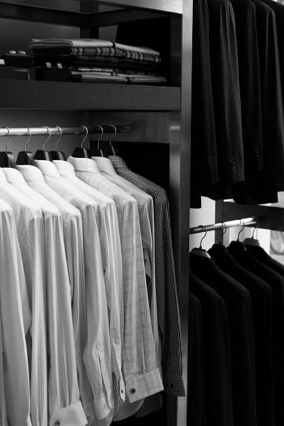 istock Men clothes hanging stacked on hanger,black and white 616121678