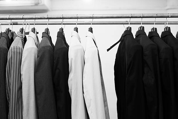 istock Suit jackets hanging stacked on hanger,close up 616121718