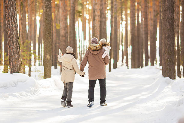 istock Father walks with his little daughter in winter 616123462