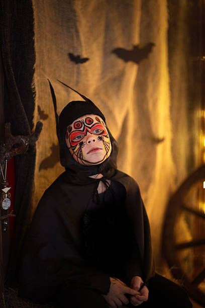 istock Boy in  suit bat on dark background, a mysterious childhood 616130256