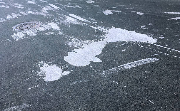 istock asphalt road texture with the white paint blots 616132928