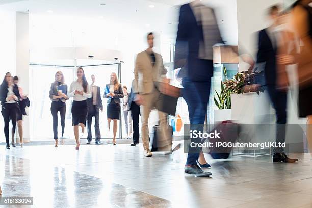 Blurred Motion Of Business People Walking At Convention Center Stock Photo - Download Image Now