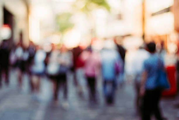 istock blur image background people walking in Hongkong,vintage tone 616135254