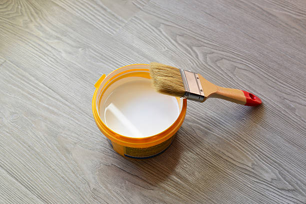 istock Bank with white paint and brush on  floor 616218626