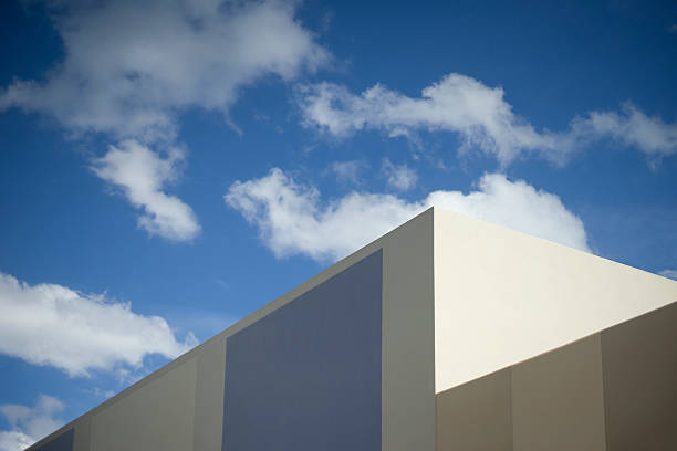 istock blue sky with a corner part of modern building 616222188