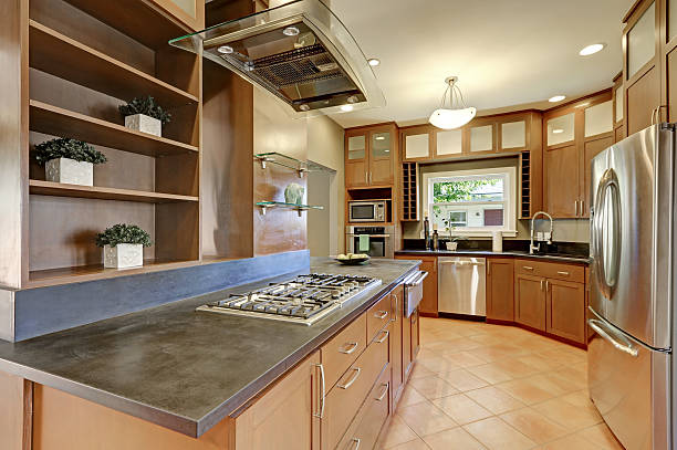 istock Large kitchen room interior with brown cabinets and steel appliances 616223410