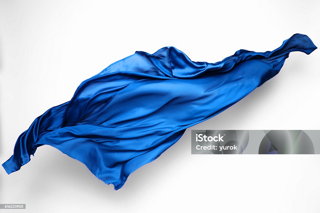 abstract blue fabric in motion abstract piece of blue fabric flying, high-speed studio shot Textile Stock Photo