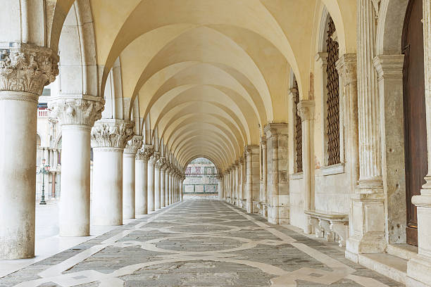 Archway underneath the Doge's Palace. Horizontally. Archway underneath the Doge's Palace in San Marco Square (Venice, Italy). Horizontally. colonnade stock pictures, royalty-free photos & images