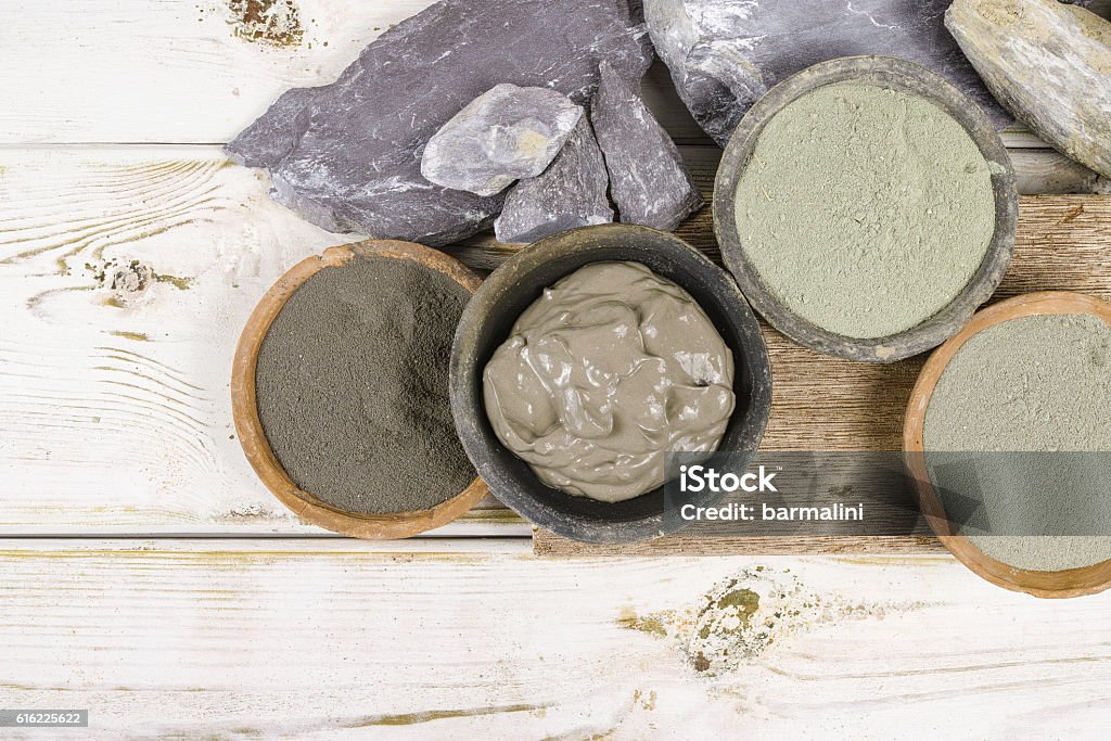 Ancient minerals - ochre, green, blue clay powder, mud mask Ancient minerals - green and blue clay powder and mud mask for spa, beauty concept Clay Stock Photo