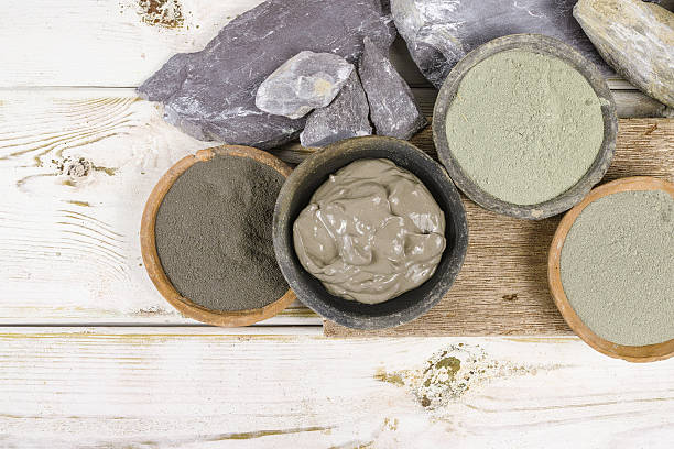 ancient minerals - ochre, green, blue clay powder, mud mask - mud spa treatment health spa massaging imagens e fotografias de stock