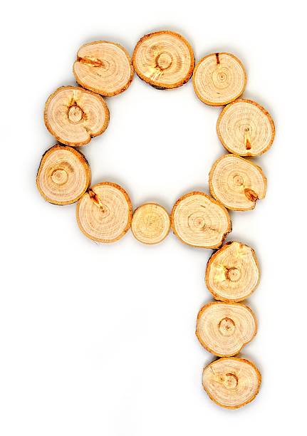 istock Alphabet letters made from Wood slice on white Background.q 616226718