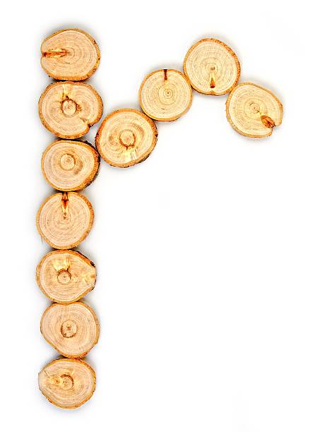 istock Alphabet letters made from Wood slice on white Background.r 616226928