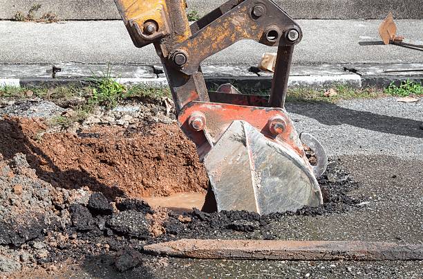 istock Excavator working on the Repair of  pipe water 616227208