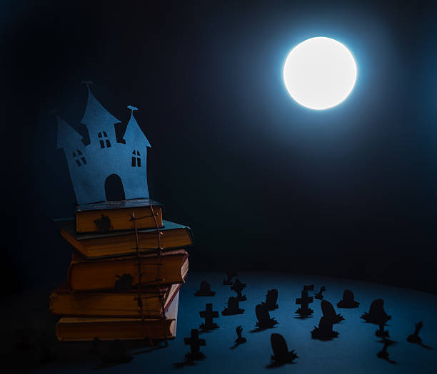 istock paper silhouettes Halloween night in the cemetery 616227536