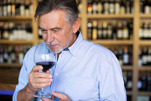 istock Man with a glass of red wine 616228254