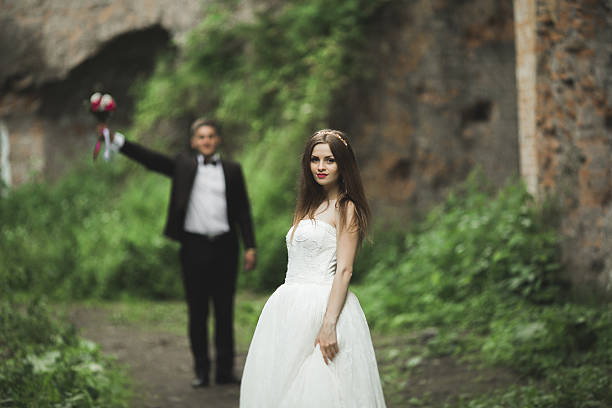 istock Beautiful bride posing near rocks with  views 616229936