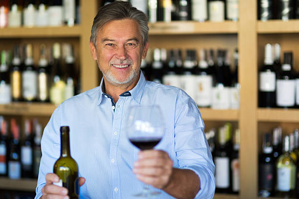 istock Man with a glass of red wine 616231400