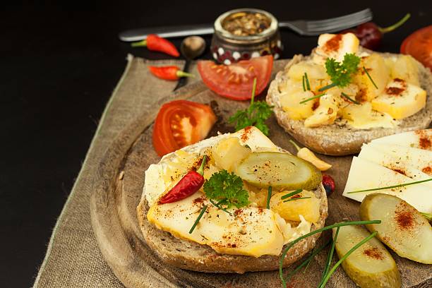 istock Two kinds of cheese on bread. Healthy breakfast 616231548