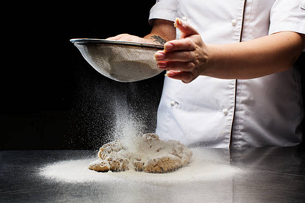 istock Woman hands kneading dough. 616232036