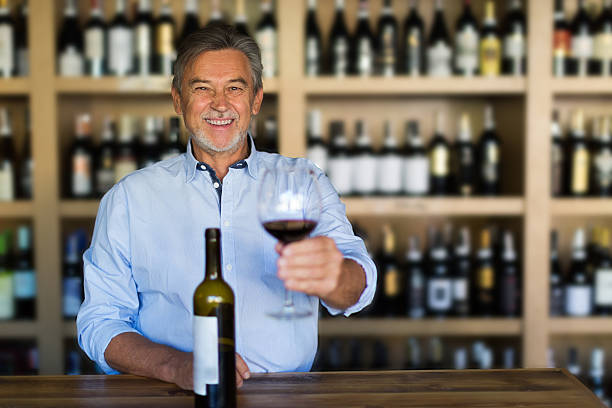 istock Man with a glass of red wine 616232064