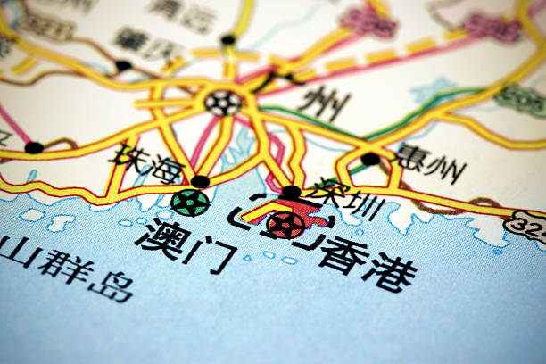 Hong Kong and Macau on map Macro picture of a map showing the Pearl RiverDelta area with Hong Kong and Macau (in Chinese: 香港 and 澳门) SARs and nearby cities including Shenzhen (深圳), Guangzhou (广州), Zhuhai (珠海), Huizhou (惠州). chinese script photos stock pictures, royalty-free photos & images