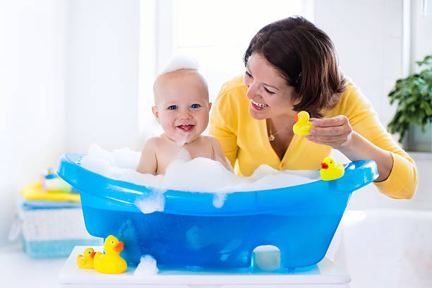 istock Young mother washing baby boy 616234452