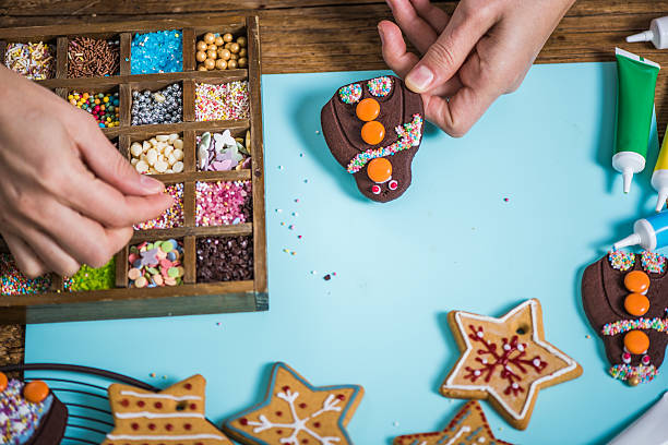 istock Decorating funny gingerbread cookies for Christmas 616235046