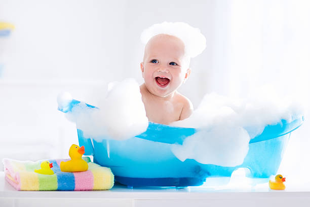 istock Happy laughing little baby taking a bath 616235470