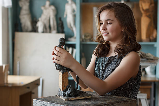 Teen Girl  in the artist's studio. stock photo