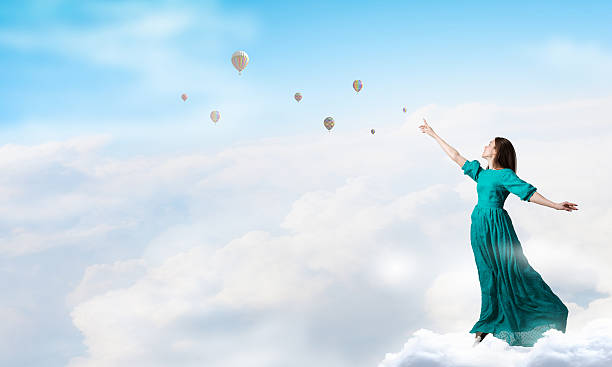 istock Woman levitating in sky . Mixed media 616238162