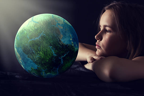 Teen girl with planet earth. stock photo