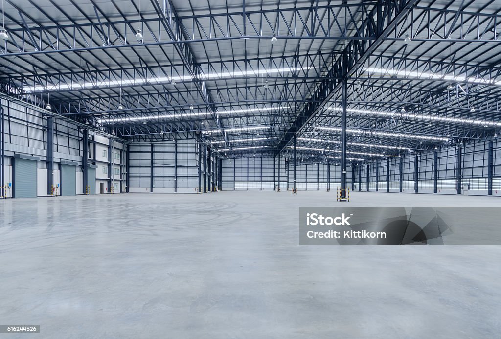 Interior of empty warehouse Flooring Stock Photo