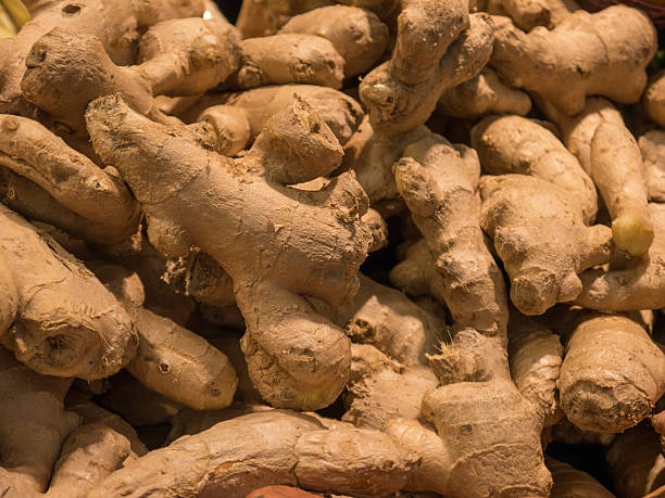 istock Delicious Ginger Roots on a Market 616245666