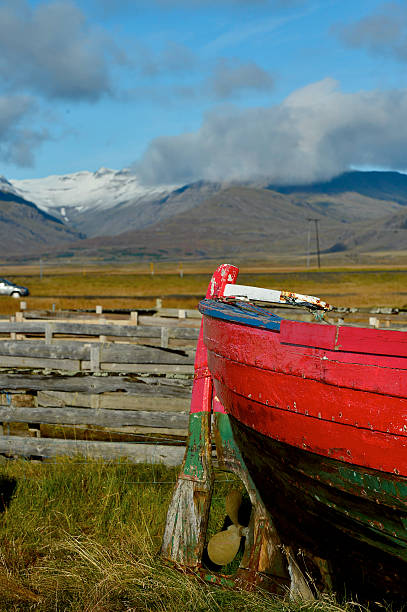 istock Abandoned boat  on the shores with  mountain 616246534