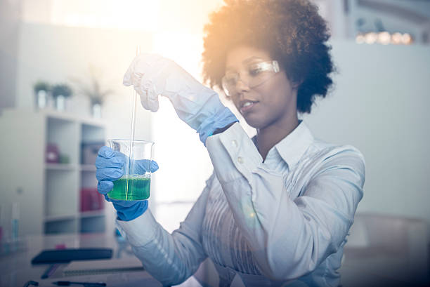 Scientist and proud A young African American woman doing experiments in the laboratory stem research stock pictures, royalty-free photos & images