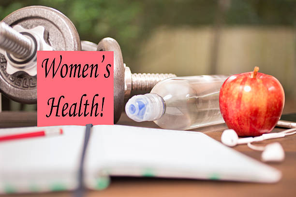 istock Fitness, exercise themed scene with Women's Health note. 616248368