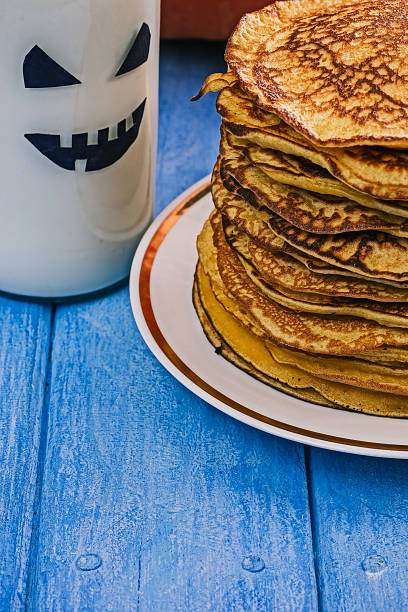 istock Pumpkin pancakes and boo milk bottle 616250356