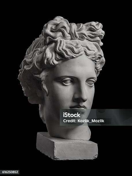 Gypsum Statue Of Apollos Head On A Black Background Stock Photo - Download Image Now