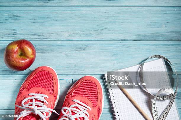 Fitness Concept Pink Sneakers Apple And Notebook And Measuring Tape Stock Photo - Download Image Now