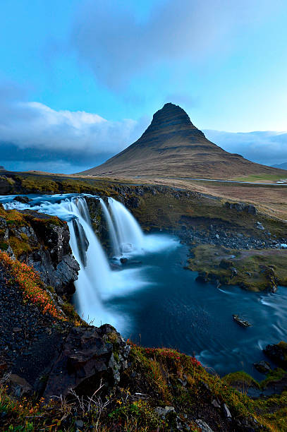 istock Amazing sunset the top of Kirkjufellsfoss waterfall 616256366