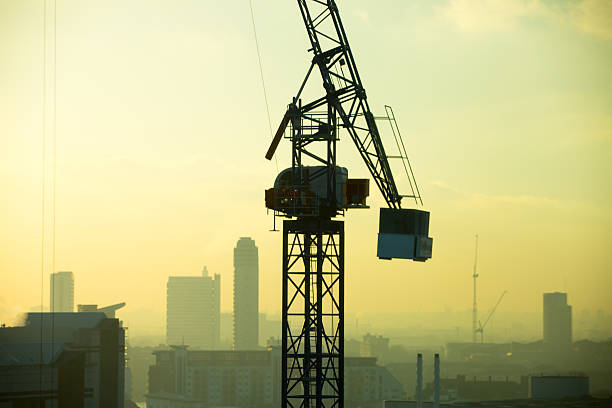 London, UK  - January 20, 2016: London at sunset aerial view with cranes