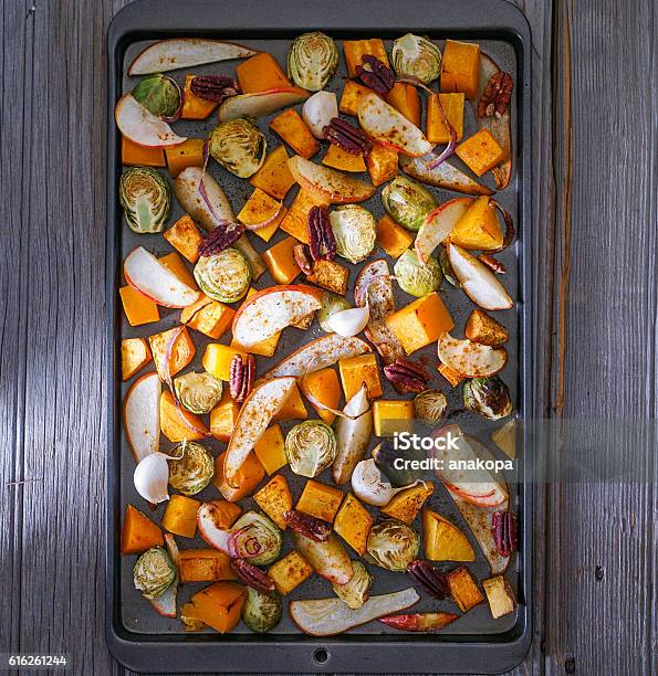 Roasted Cut Vegetables And Fruit On A Baking Sheet Stock Photo - Download Image Now