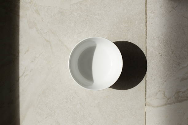 istock empty bowls, plates and cups on gray background 616262336