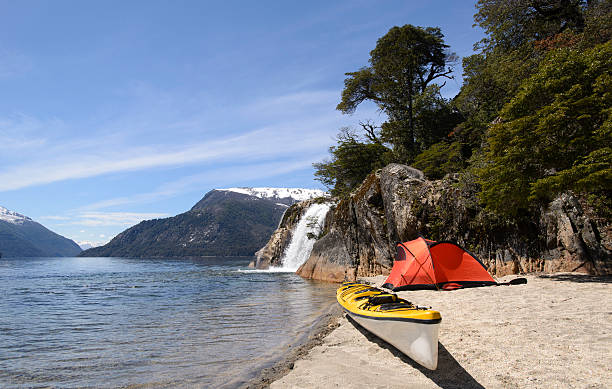 Exploring Patagonia Sea Kayak Patagonia lakes exploring them kayaking and camping. Nahuel Huapi National Park, San Carlos de Bariloche, Argentina. nahuel huapi national park stock pictures, royalty-free photos & images