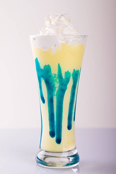 istock banana milkshake on a white wood background 616264702